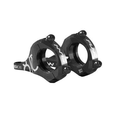 A pair of black RSX Direct Mount Stem clamps featuring engraved white logos, adjustment markings, visible bolt holes, and a sleek angular design.