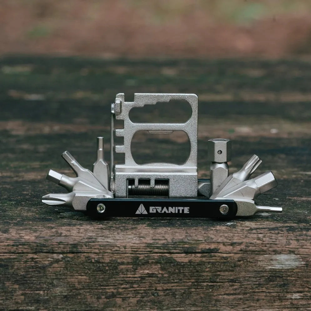 Granite Diverse 20 Multi Tool with various components on a wooden surface