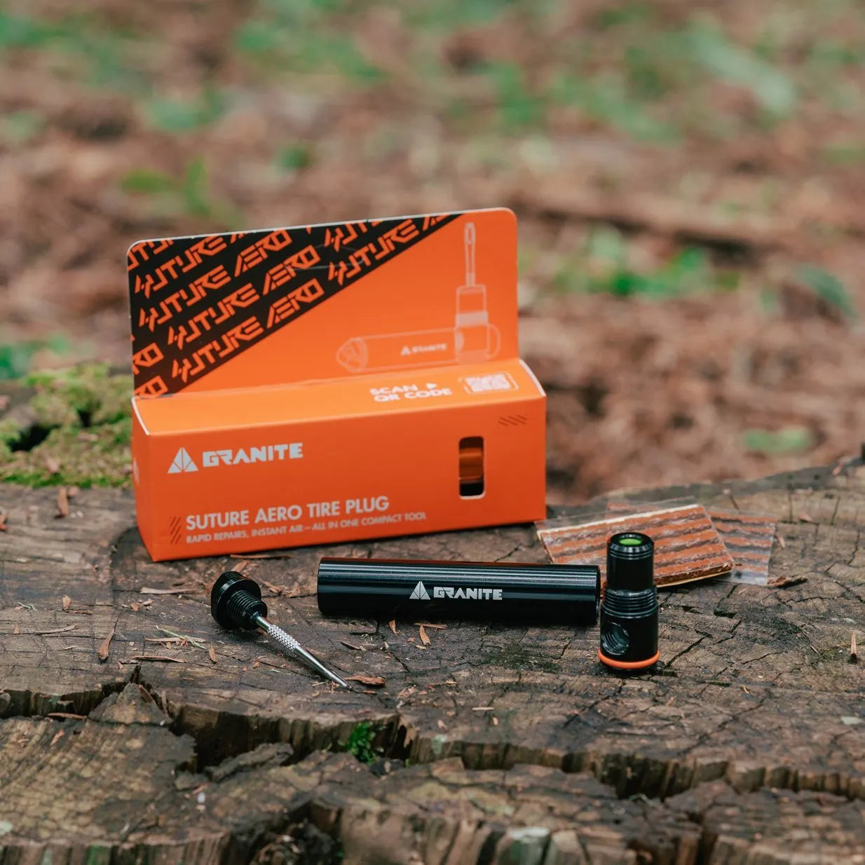Granite Suture Aero tire plug packaging and tools on a wooden surface with a natural background